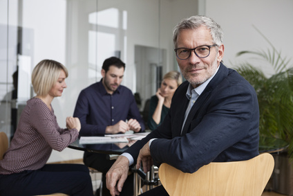 Business people having team meeting in office